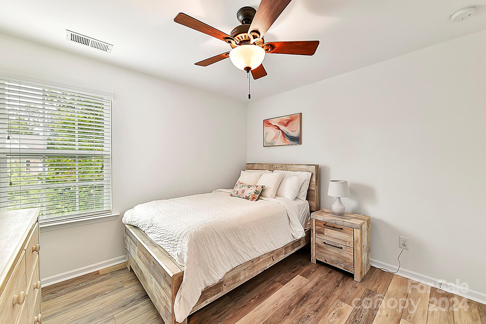 1201 Screech Owl Road Waxhaw, NC 28173 - Photo 32 of 43 a bedroom with a bed and a window