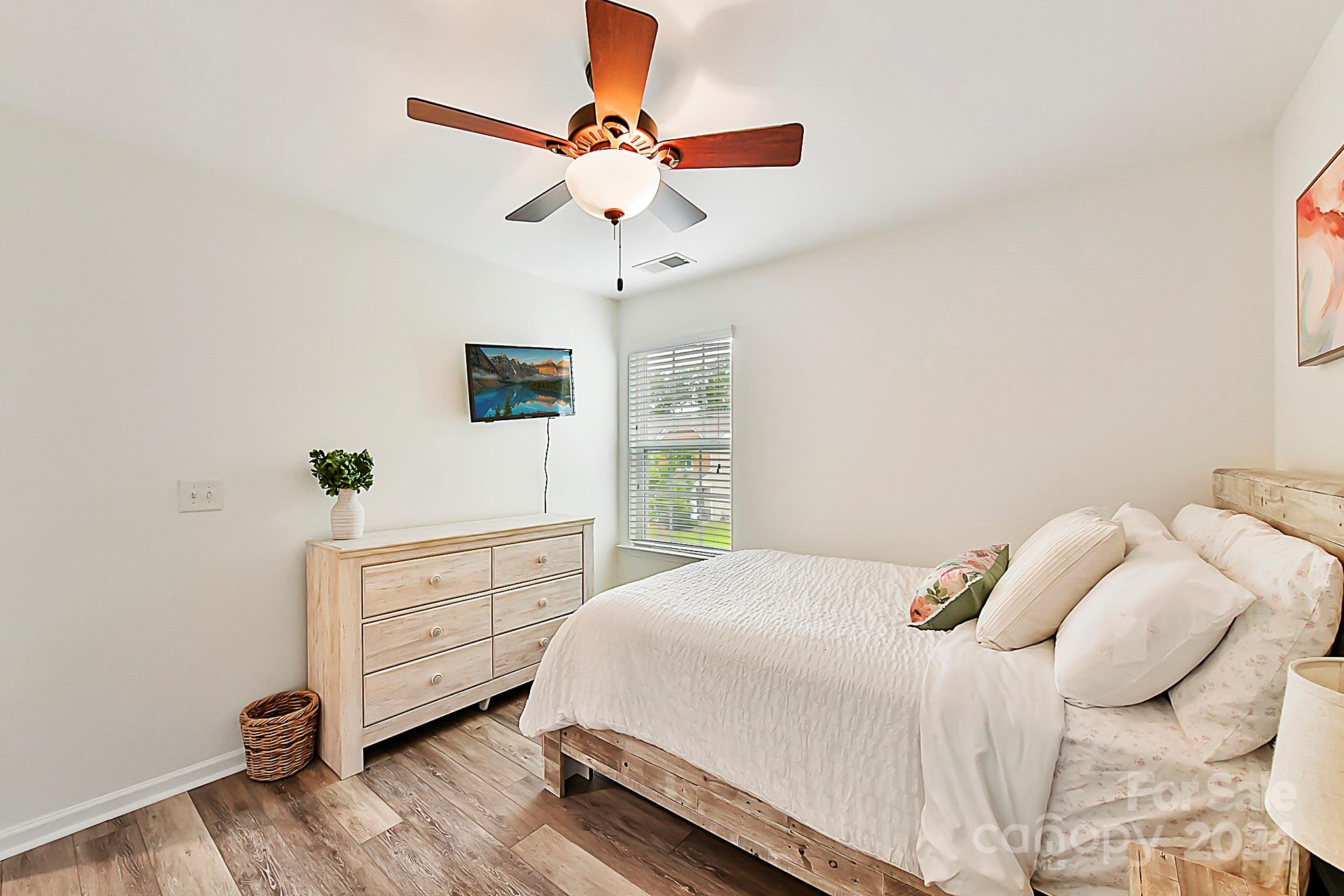 1201 Screech Owl Road Waxhaw, NC 28173 - Photo 33 of 43 a bedroom with a bed and a dresser