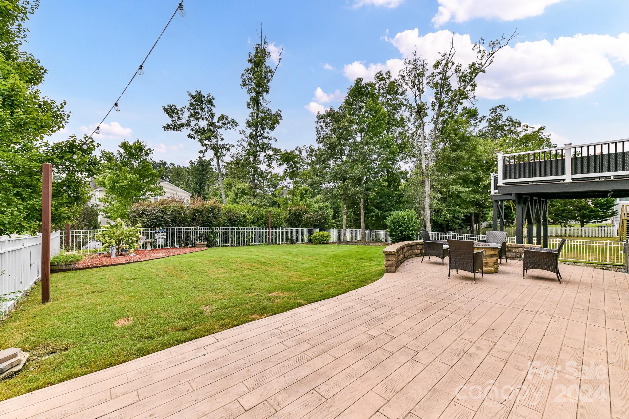 1201 Screech Owl Road Waxhaw, NC 28173 - Photo 40 of 43 a view of a patio with a table and chairs