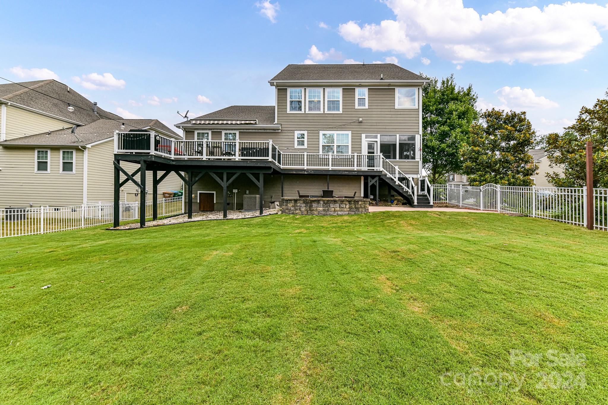 1201 Screech Owl Road Waxhaw, NC 28173 - Photo 42 of 43 a view of a house with a big yard and large trees