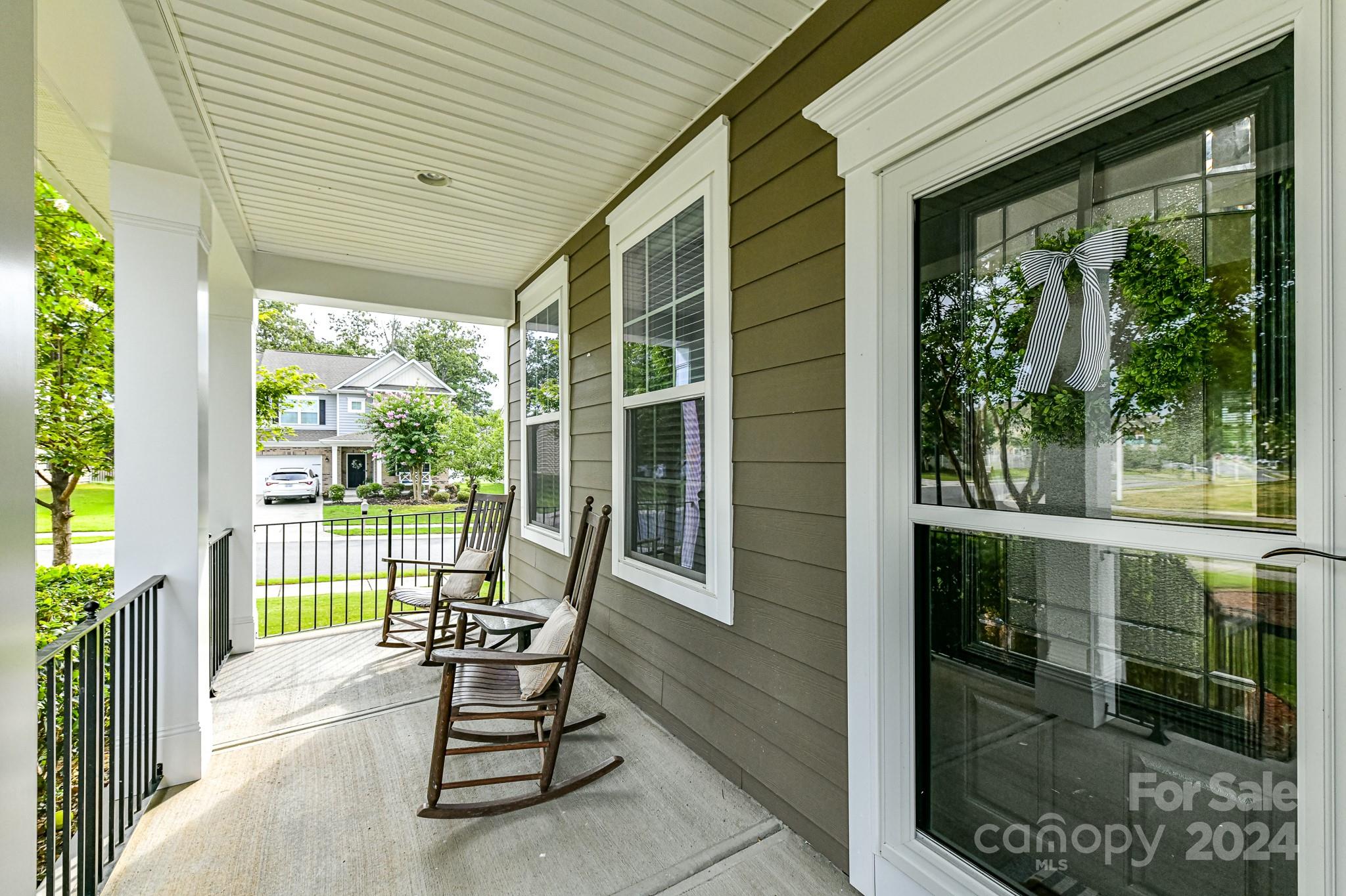 1201 Screech Owl Road Waxhaw, NC 28173 - Photo 5 of 43 a view of a two chair in the balcony