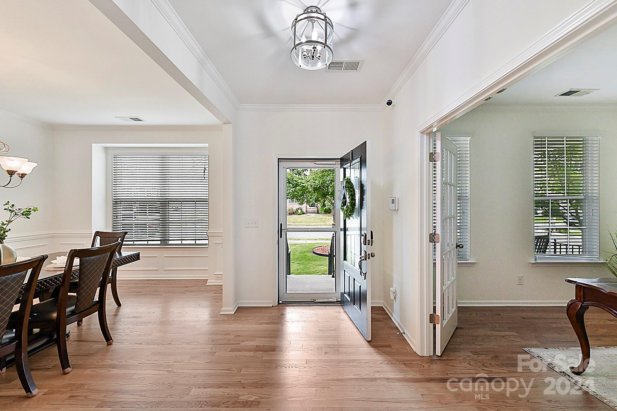 1201 Screech Owl Road Waxhaw, NC 28173 - Photo 7 of 43 a view of a dining room with furniture window and wooden floor