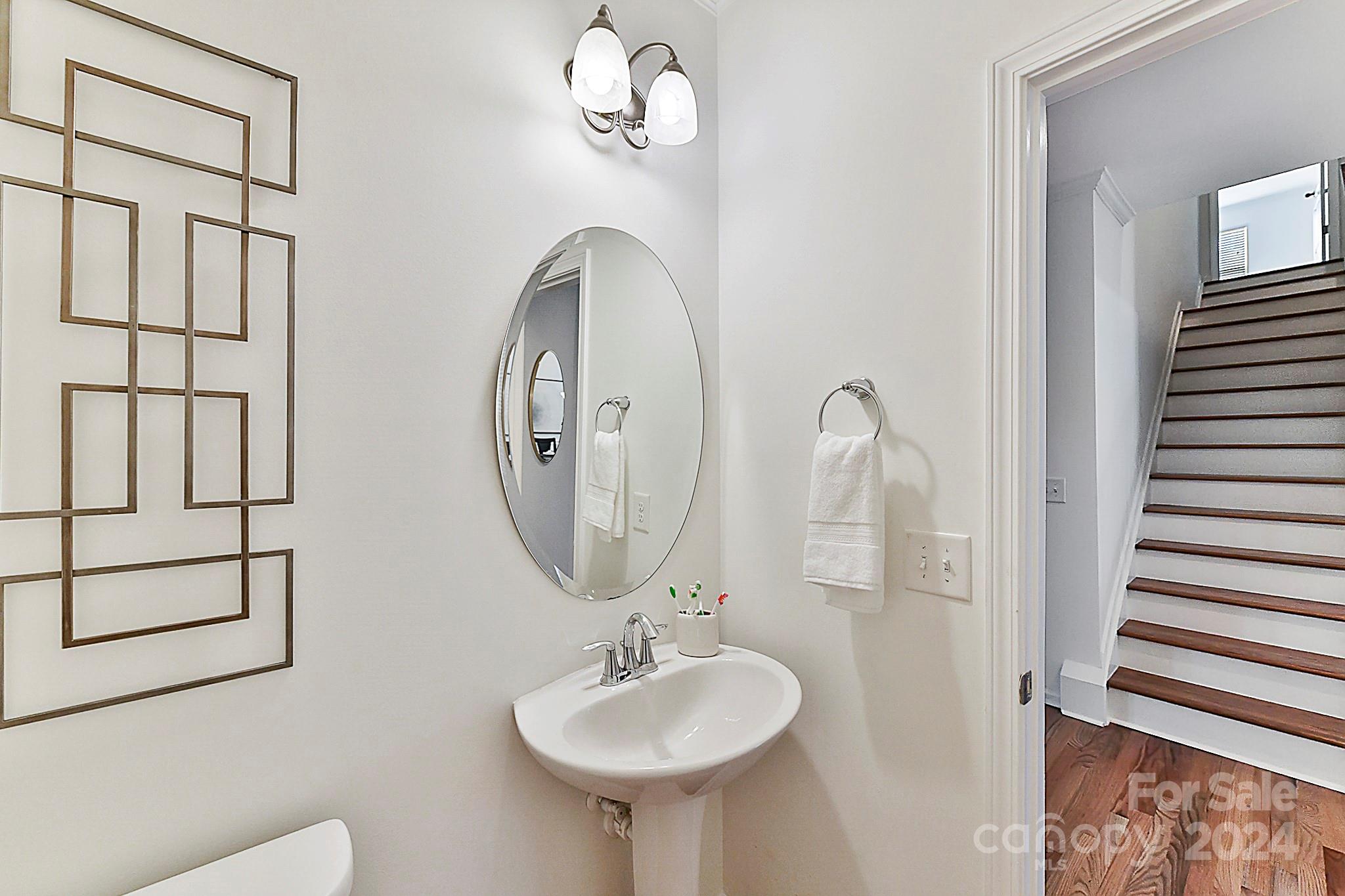 1201 Screech Owl Road Waxhaw, NC 28173 - Photo 10 of 43 a bathroom with a sink a mirror and a shower