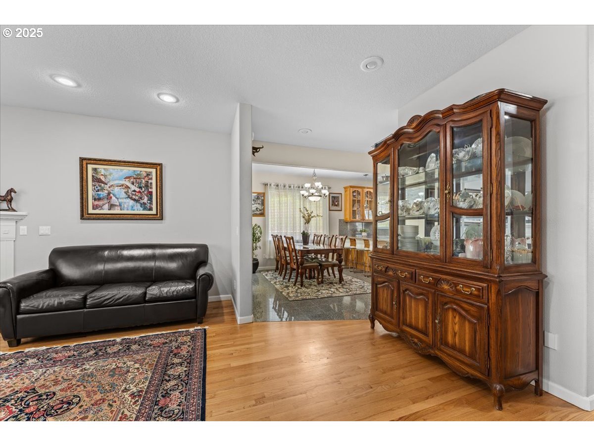 5122 Southeast Jenne Road Portland, OR 97236 - Photo 27 of 36 a living room with furniture and a wooden floor