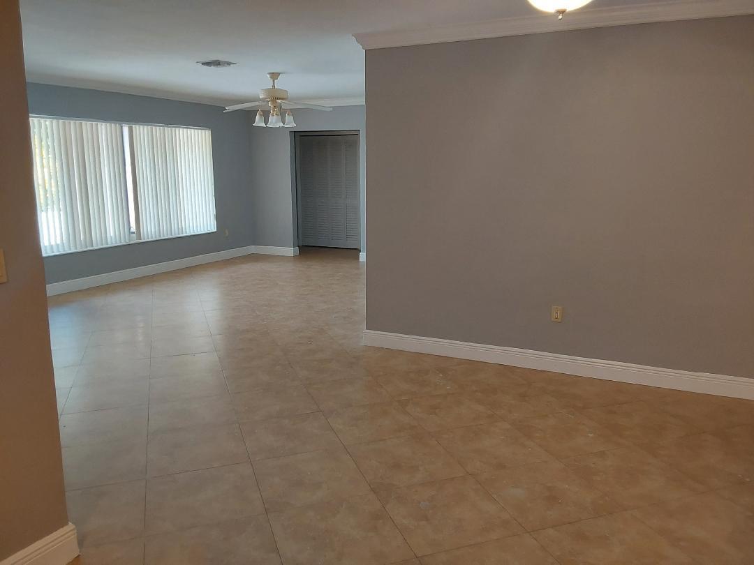 98 Seminole Lane Boca Raton, FL 33487 - Photo 27 of 42 an empty room with a empty space and windows