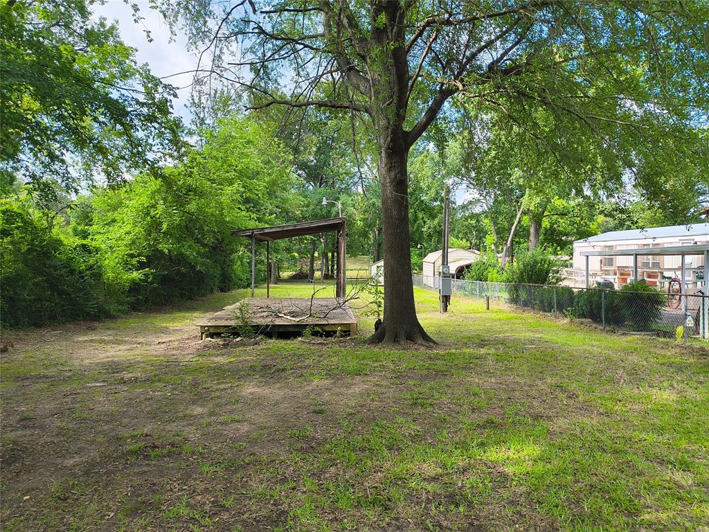 180 Arrowhead Street Mabank, TX 75156 - Photo 5 of 26 a view of a park with large trees
