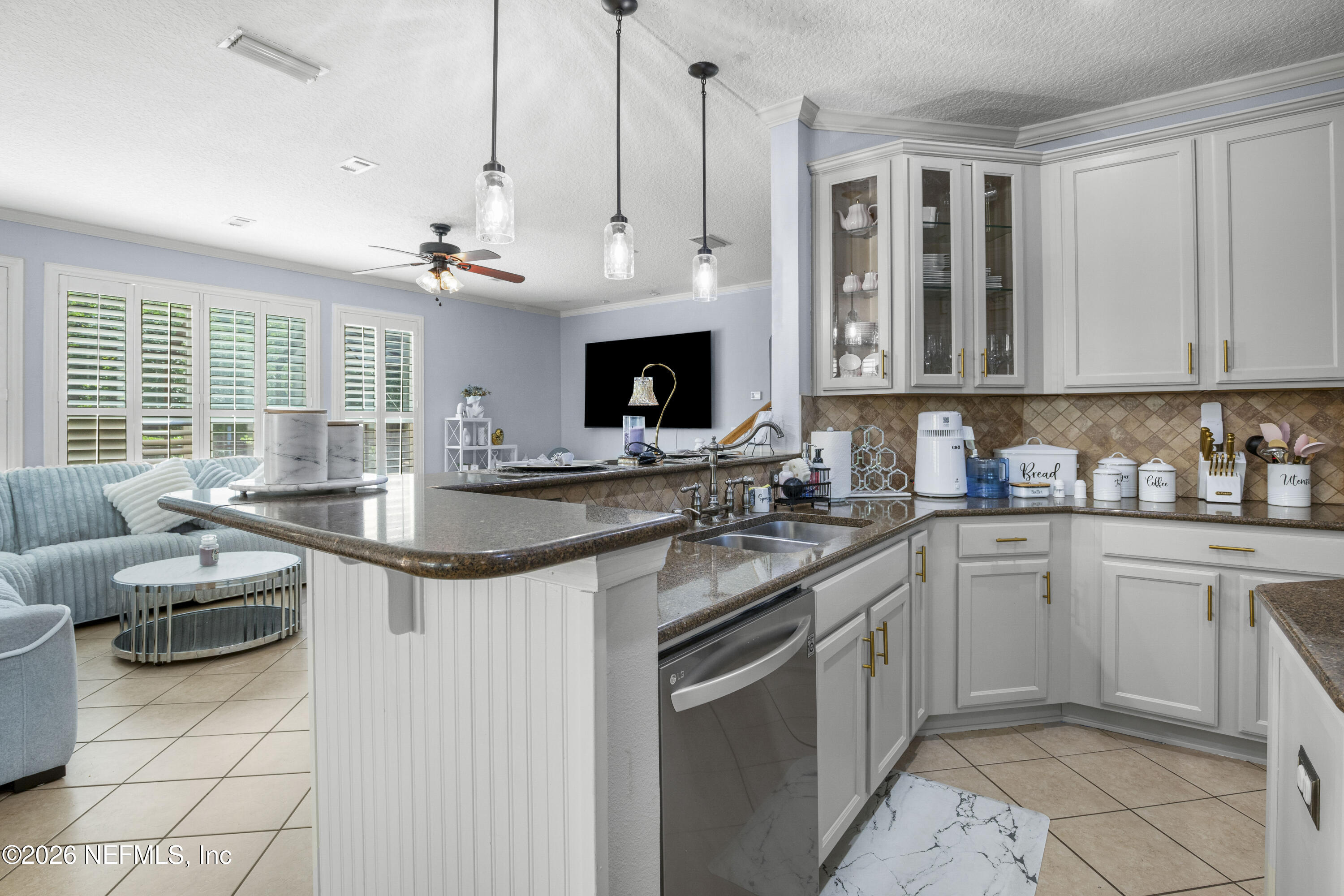 3020 South Atherley Road St. Augustine, FL 32092 - Photo 16 of 61 a kitchen with granite countertop a sink and a stove