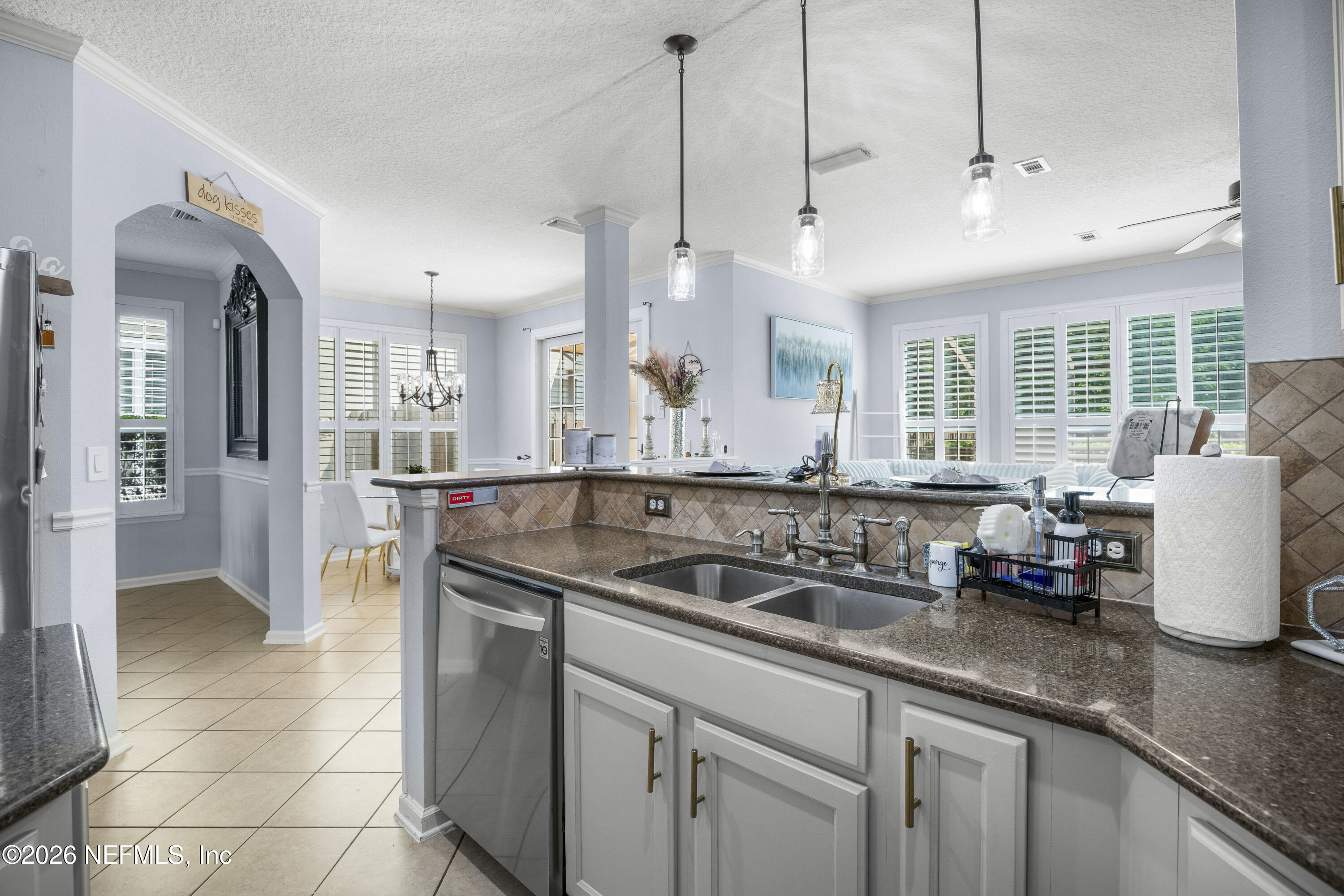 3020 South Atherley Road St. Augustine, FL 32092 - Photo 18 of 61 a kitchen with stainless steel appliances granite countertop a sink a counter space and cabinets