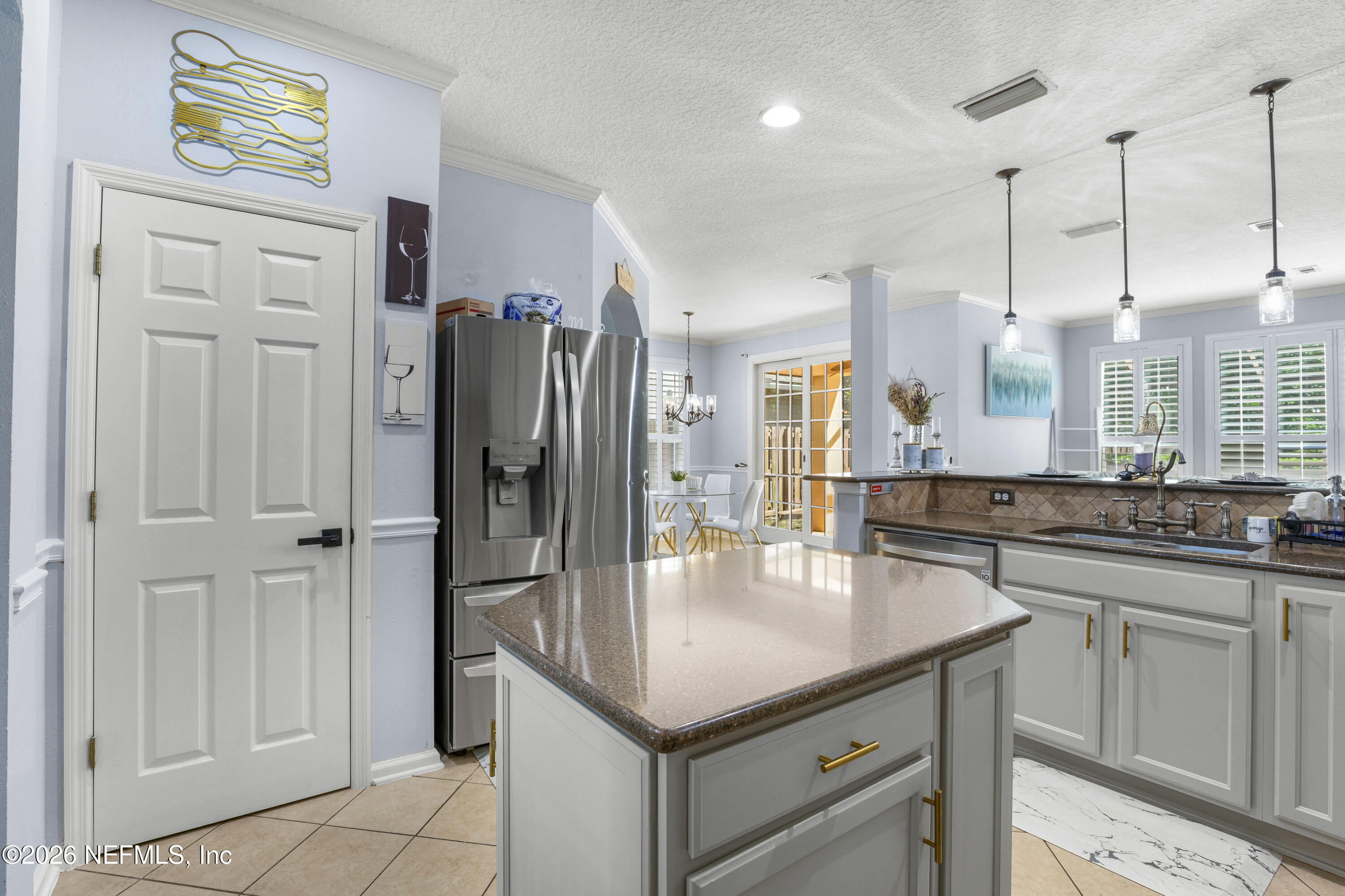 3020 South Atherley Road St. Augustine, FL 32092 - Photo 20 of 61 a kitchen with stainless steel appliances granite countertop a refrigerator a sink and a stove