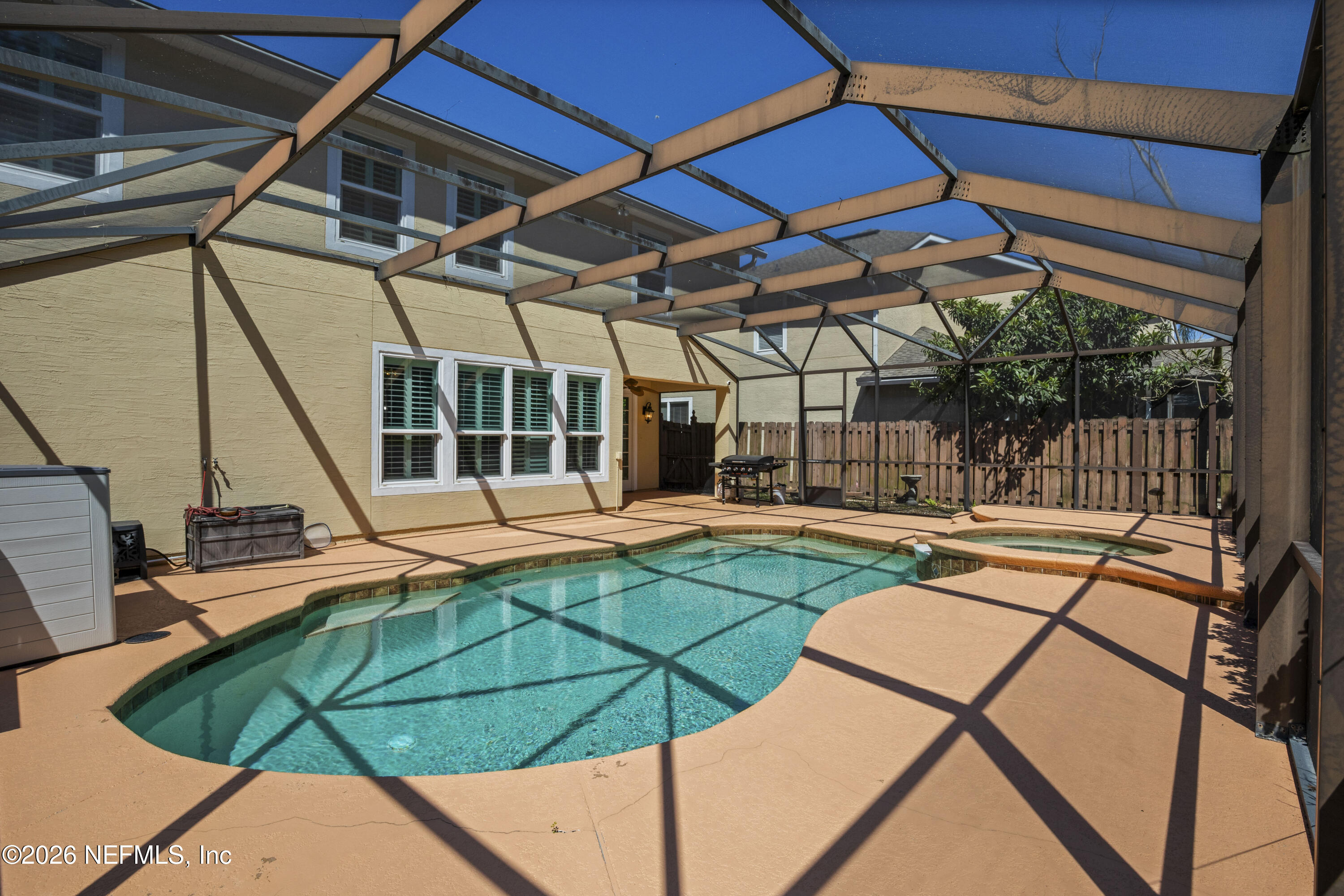 3020 South Atherley Road St. Augustine, FL 32092 - Photo 2 of 61 a view of a backyard with swimming pool and sitting area