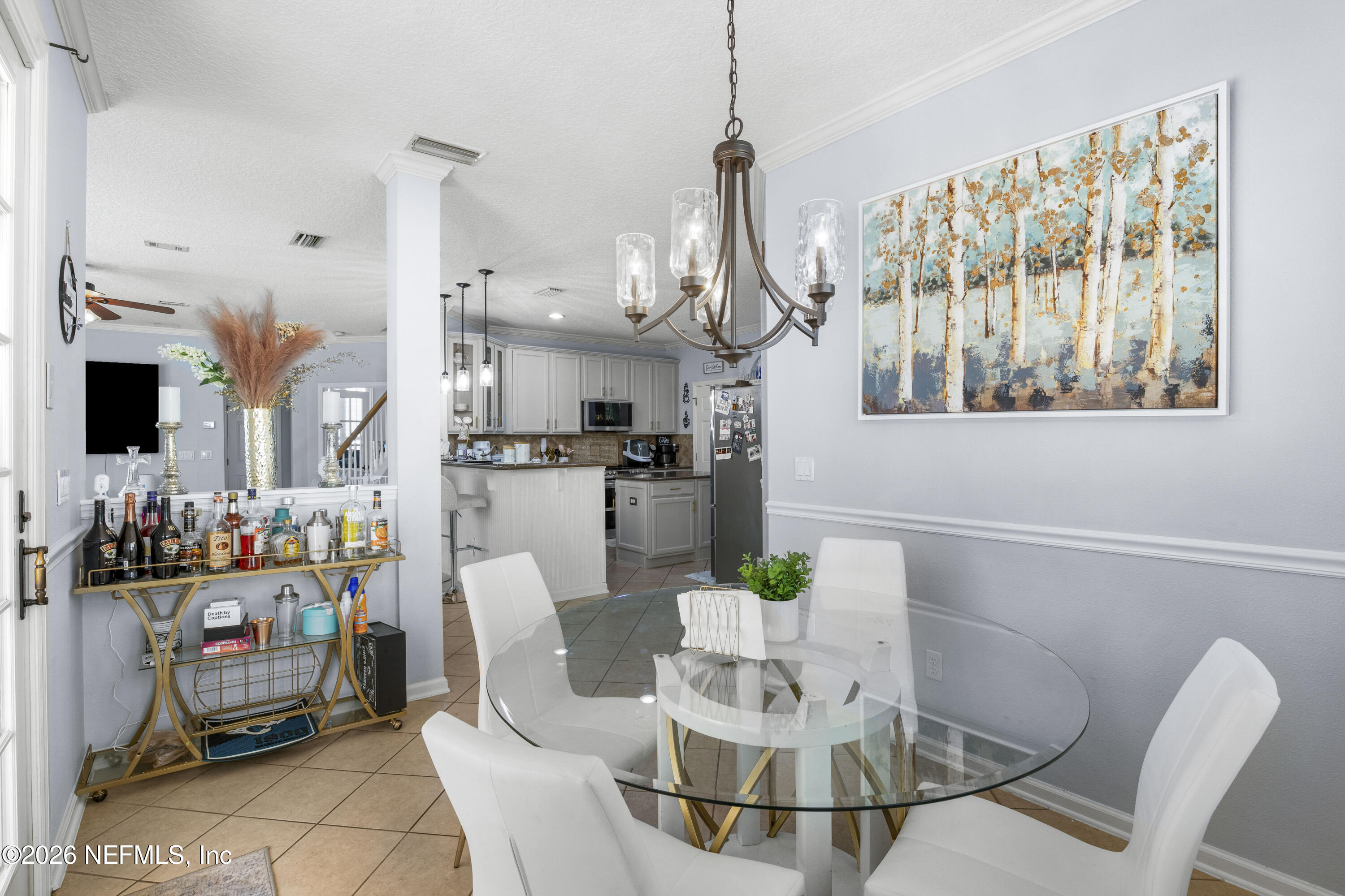 3020 South Atherley Road St. Augustine, FL 32092 - Photo 23 of 61 a dining room with furniture a chandelier and window