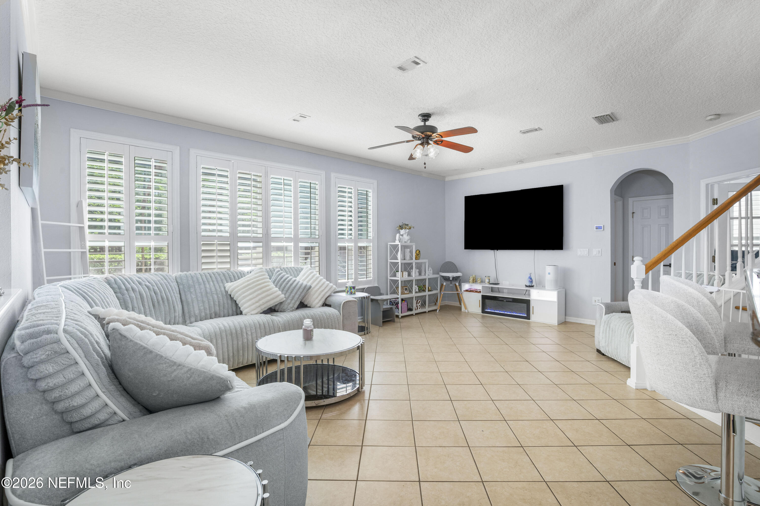 3020 South Atherley Road St. Augustine, FL 32092 - Photo 24 of 61 a living room with furniture and a flat screen tv