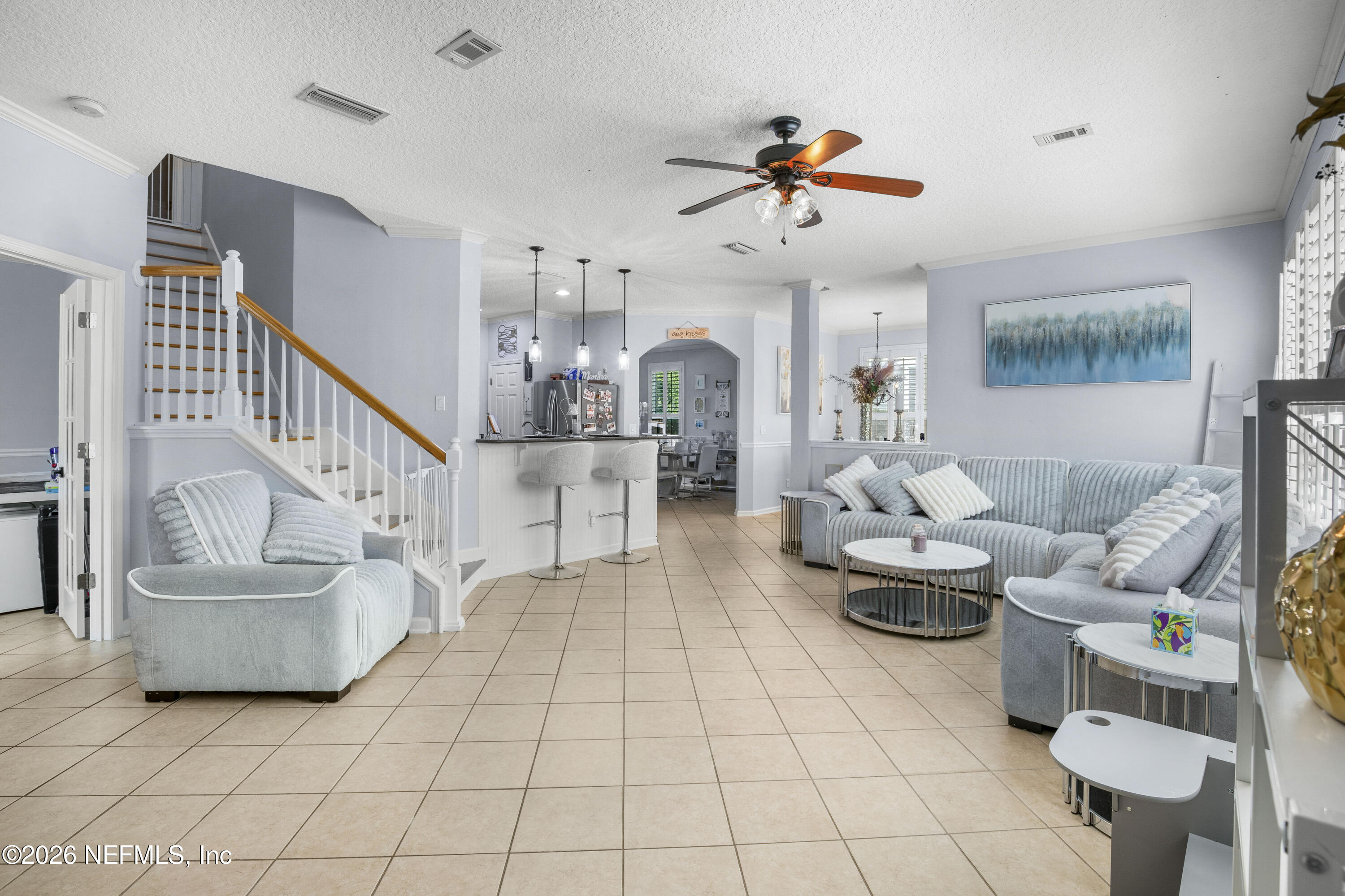 3020 South Atherley Road St. Augustine, FL 32092 - Photo 25 of 61 a living room with couches and kitchen view with wooden floor