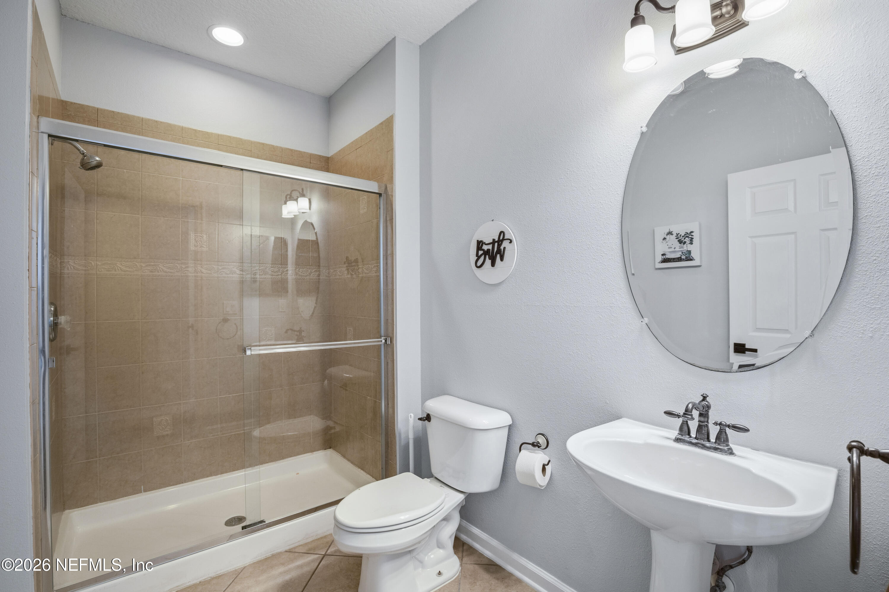3020 South Atherley Road St. Augustine, FL 32092 - Photo 27 of 61 a bathroom with a sink toilet and shower