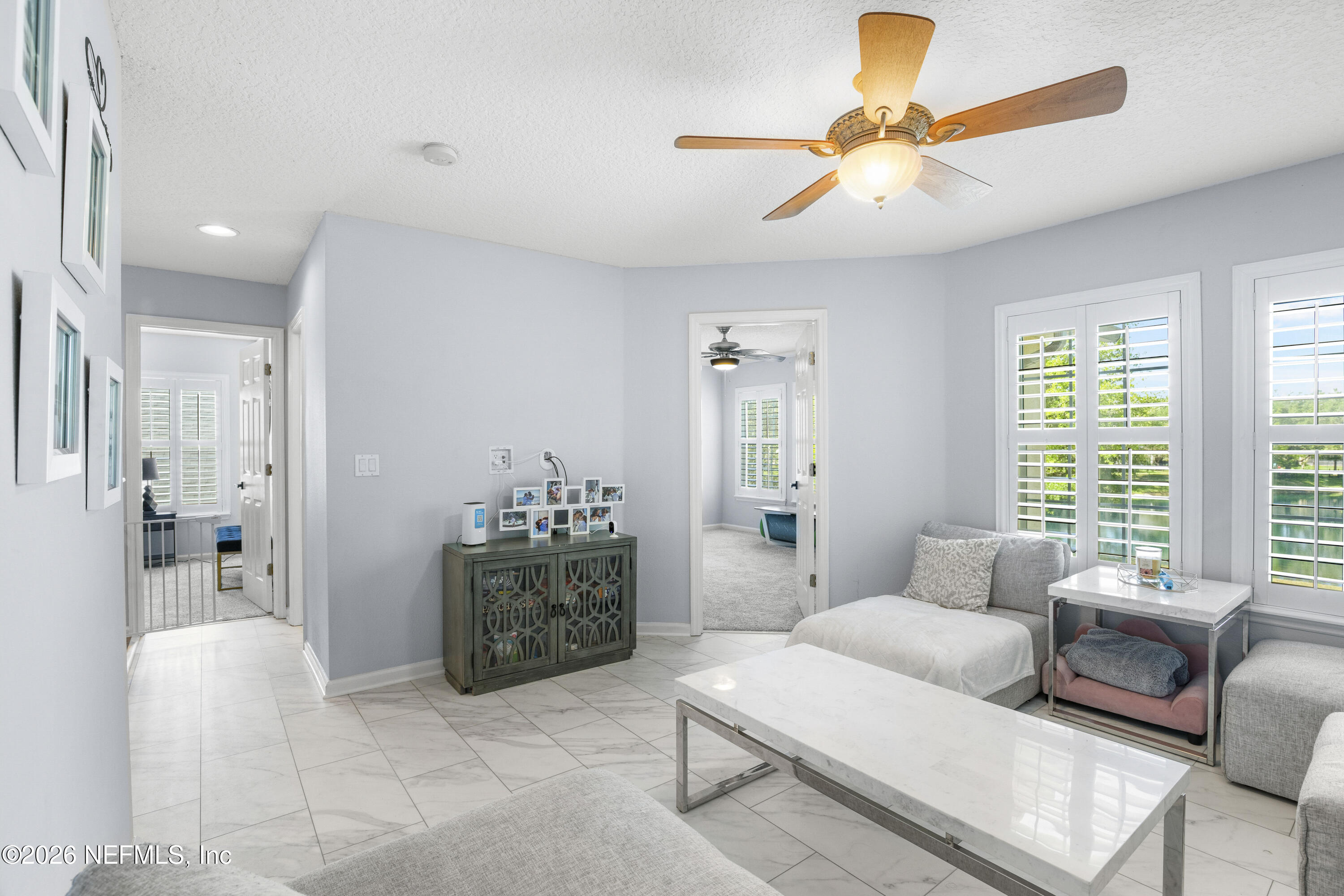 3020 South Atherley Road St. Augustine, FL 32092 - Photo 36 of 61 a living room with furniture and windows