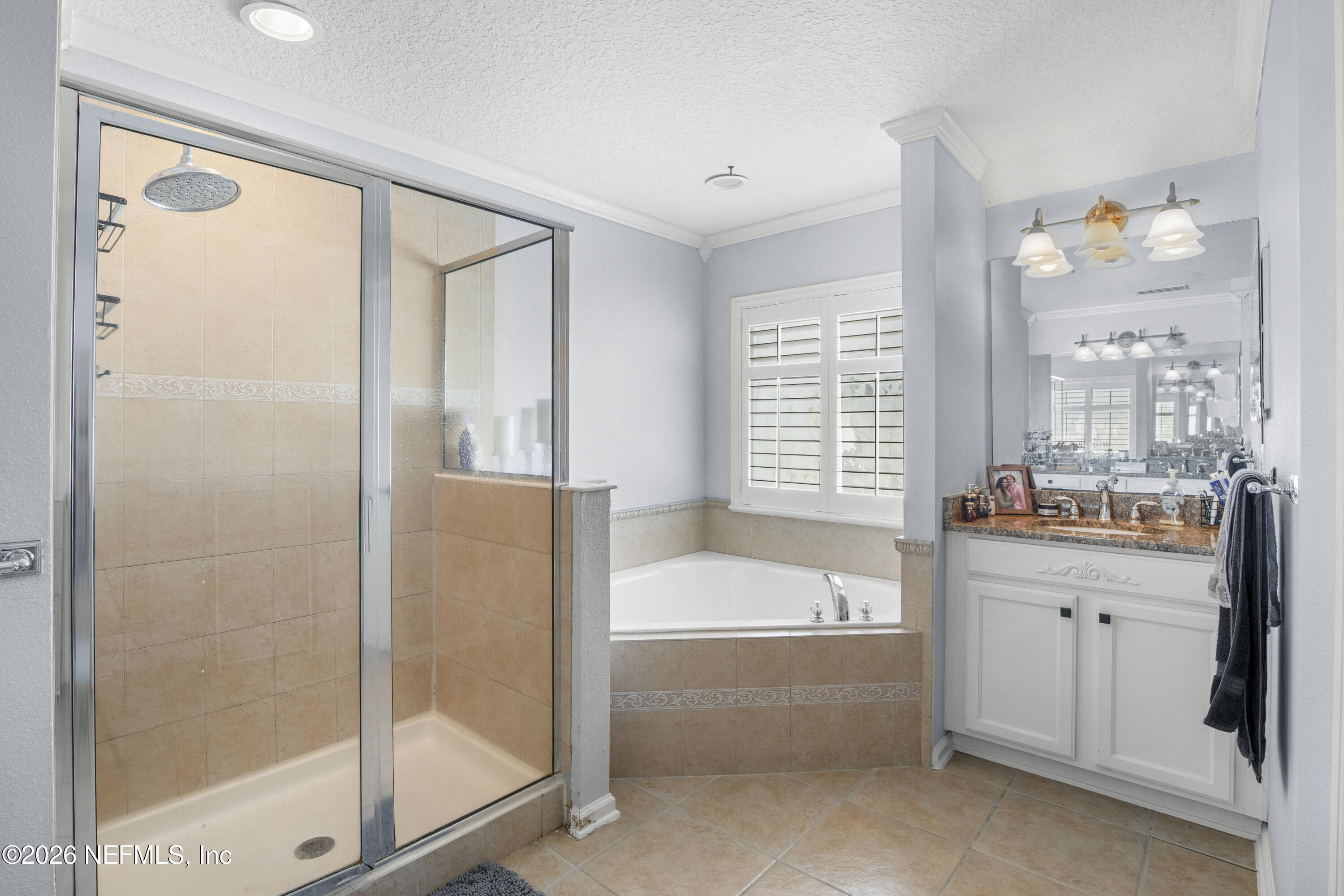 3020 South Atherley Road St. Augustine, FL 32092 - Photo 42 of 61 a bathroom with a bathtub and a shower