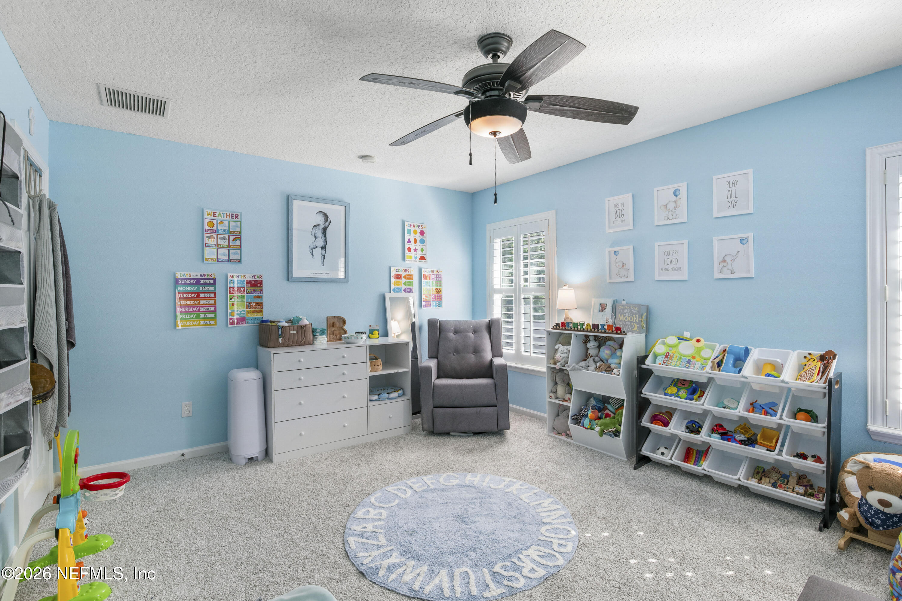 3020 South Atherley Road St. Augustine, FL 32092 - Photo 46 of 61 a living room with furniture and a baby crib