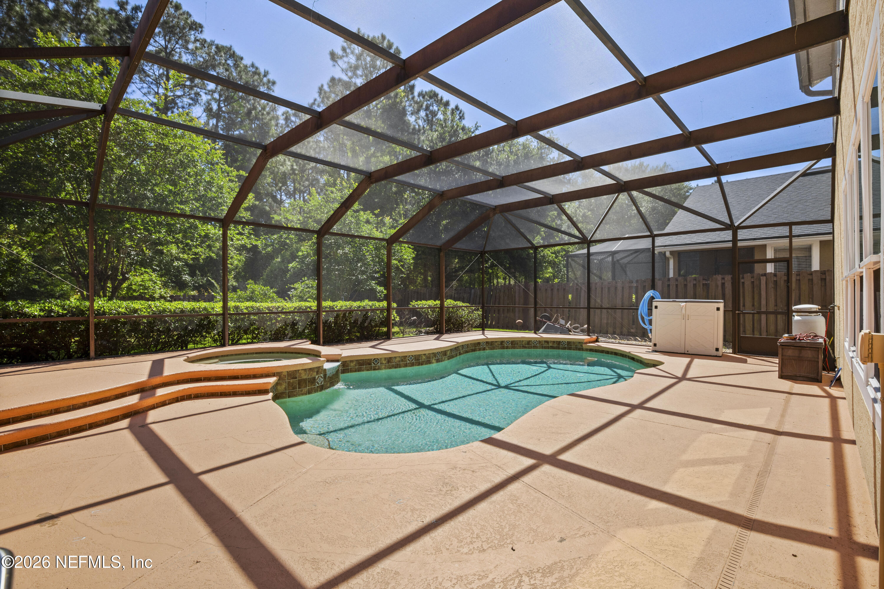 3020 South Atherley Road St. Augustine, FL 32092 - Photo 50 of 61 a view of a swimming pool with a bench in patio