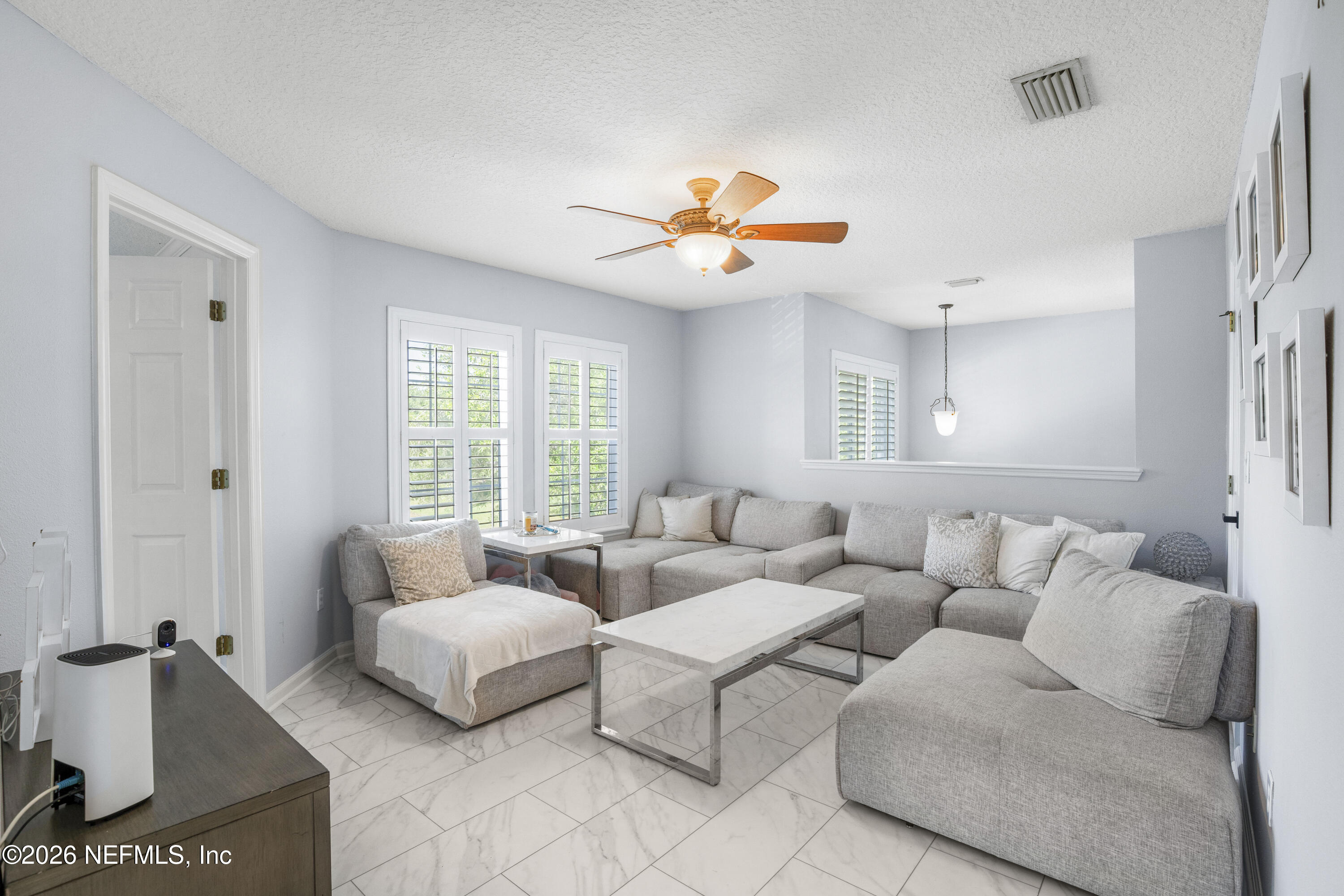 3020 South Atherley Road St. Augustine, FL 32092 - Photo 7 of 61 a living room with furniture and a large window