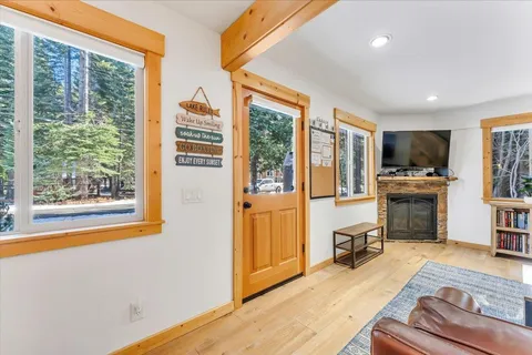a view of a livingroom with kitchen appliances and furniture