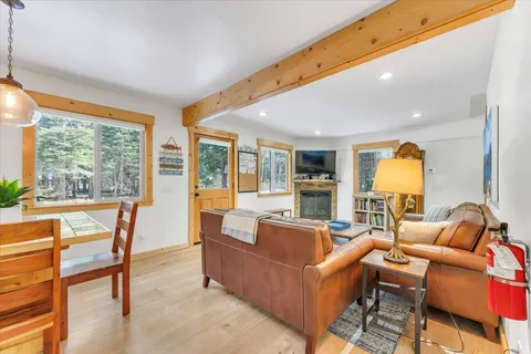 a living room with furniture and a lamp