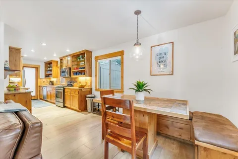 a dining room with furniture and chandelier