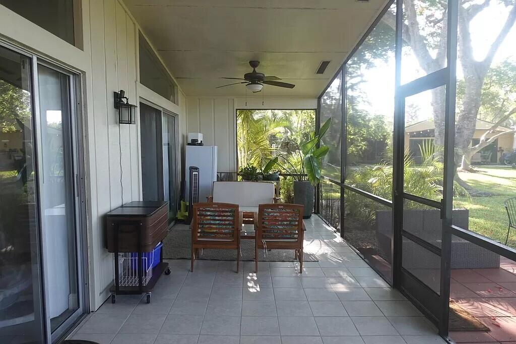 11720 Timbers Way Boca Raton, FL 33428 - Photo 17 of 19 a view of a porch with chairs and backyard