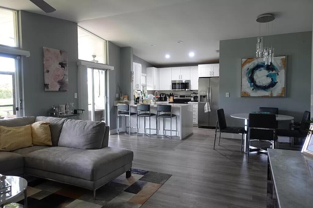 11720 Timbers Way Boca Raton, FL 33428 - Photo 4 of 19 a living room with furniture kitchen and a window