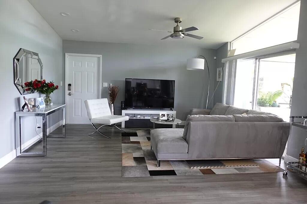 11720 Timbers Way Boca Raton, FL 33428 - Photo 5 of 19 a living room with furniture and a flat screen tv