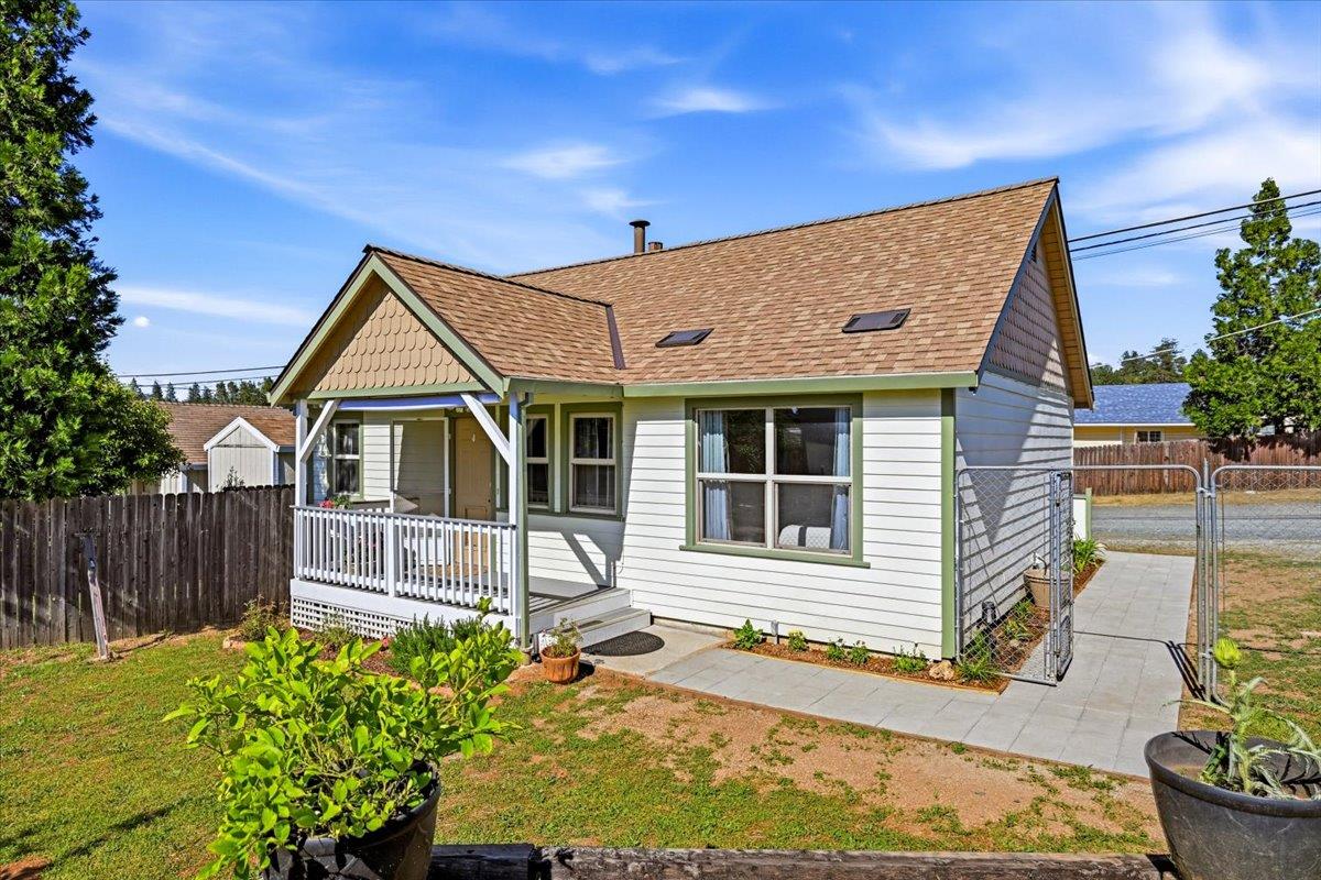 232 Upper Slate Creek Road Grass Valley, CA 95945 - Photo 1 of 48 a front view of a house with a yard