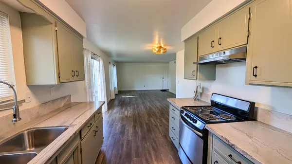 a kitchen with a stove and a sink