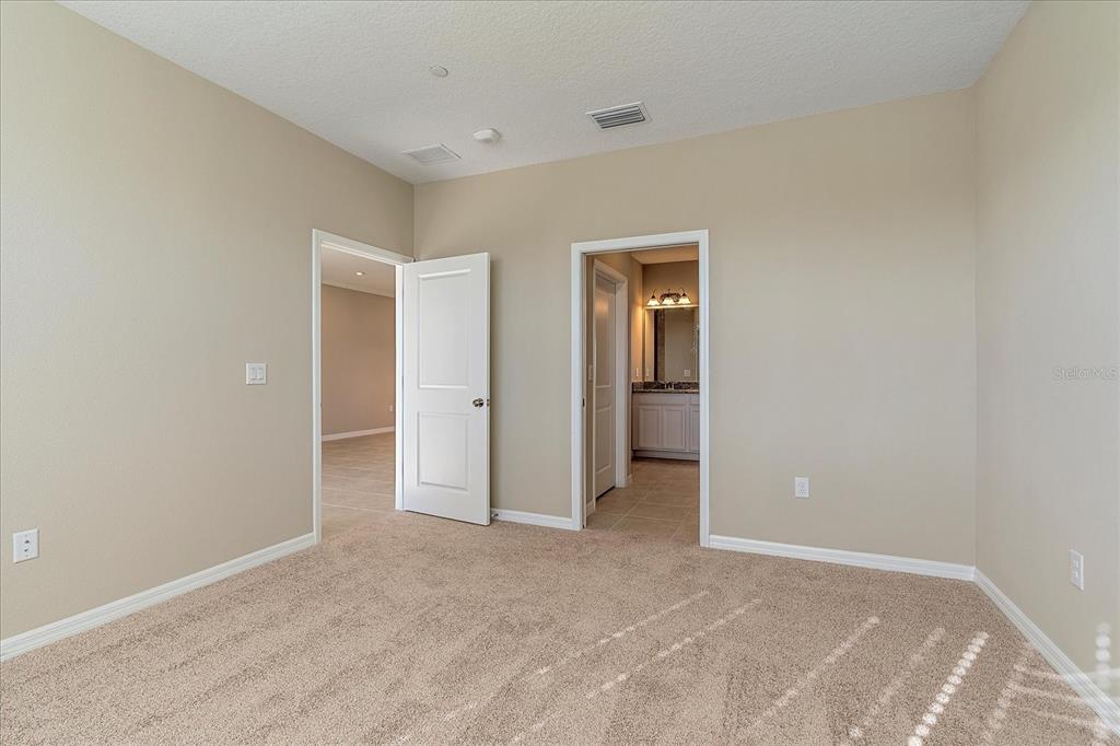 12410 Osorio Court, Unit 201 Sarasota, FL 34238 - Photo 11 of 42 wooden floor and closet in a room