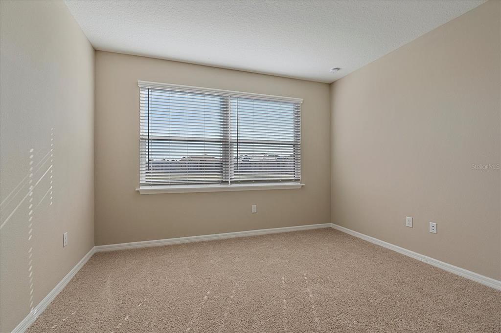 12410 Osorio Court, Unit 201 Sarasota, FL 34238 - Photo 12 of 42 an empty room with windows