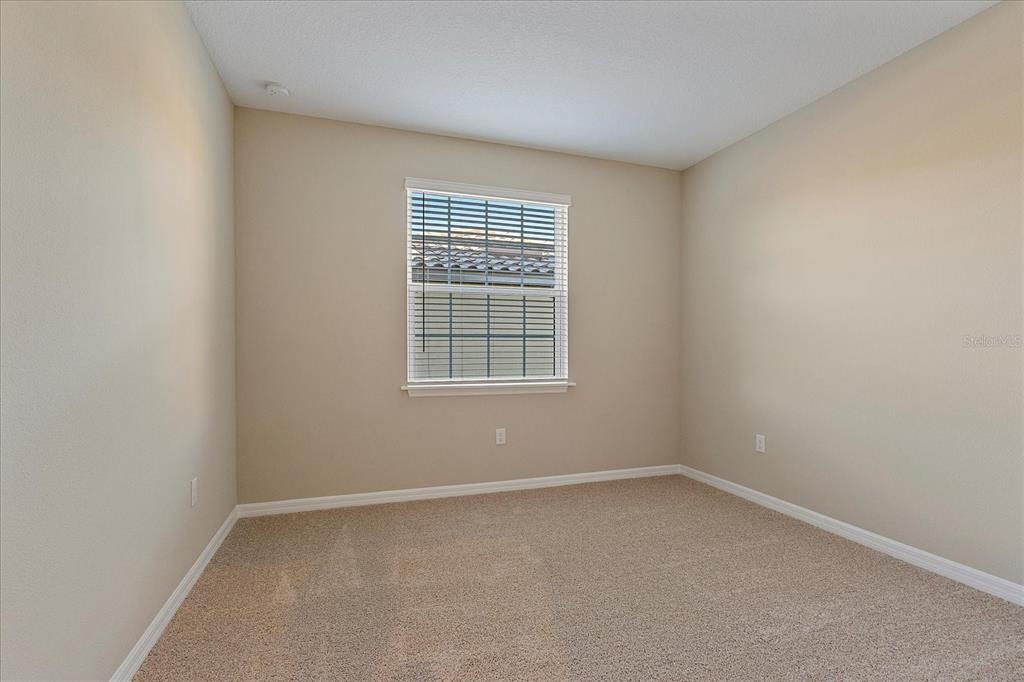 12410 Osorio Court, Unit 201 Sarasota, FL 34238 - Photo 15 of 42 an empty room with a window