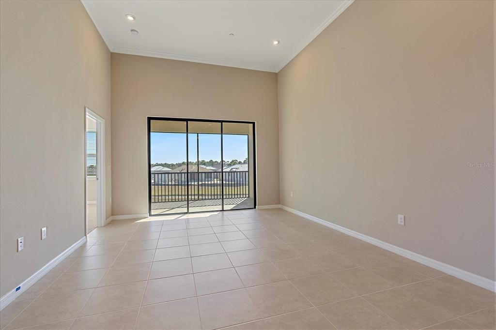 12410 Osorio Court, Unit 201 Sarasota, FL 34238 - Photo 2 of 42 wooden floor in an empty room with a window