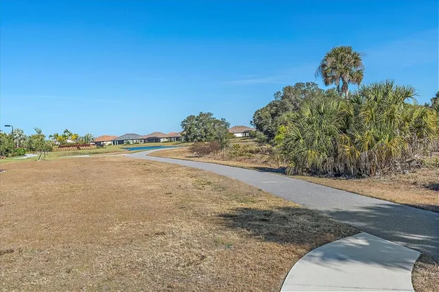 a view of a large body of water with a building in the background