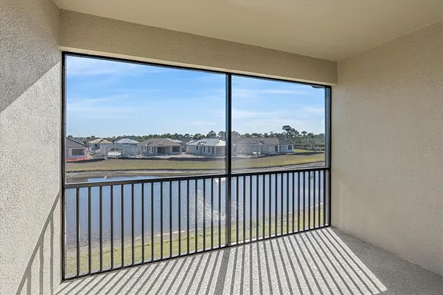 a view of a balcony with wooden floor