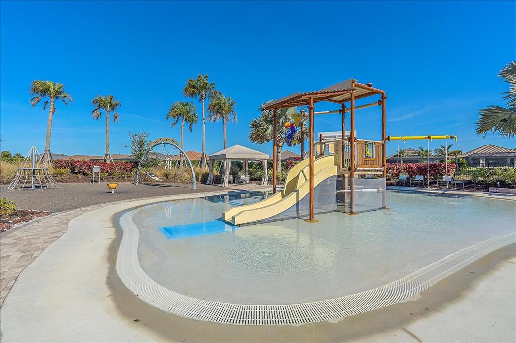 12410 Osorio Court, Unit 201 Sarasota, FL 34238 - Photo 32 of 42 a view of a swimming pool with a patio