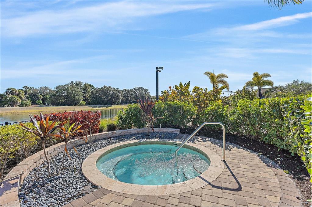 12410 Osorio Court, Unit 201 Sarasota, FL 34238 - Photo 33 of 42 a house view with a garden space