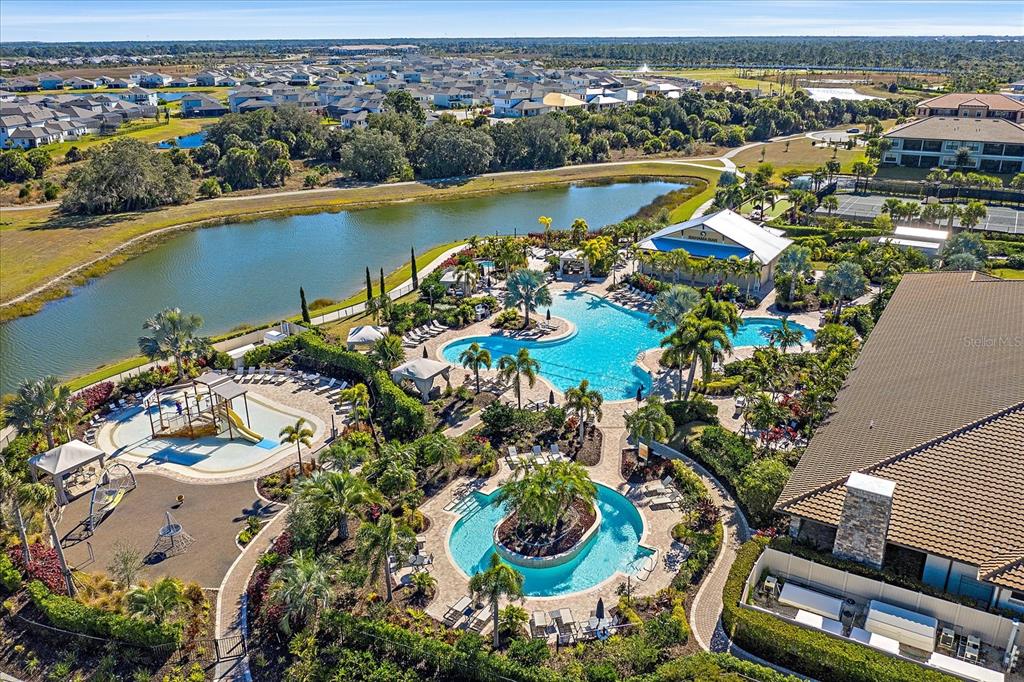 12410 Osorio Court, Unit 201 Sarasota, FL 34238 - Photo 37 of 42 an aerial view of residential houses with outdoor space