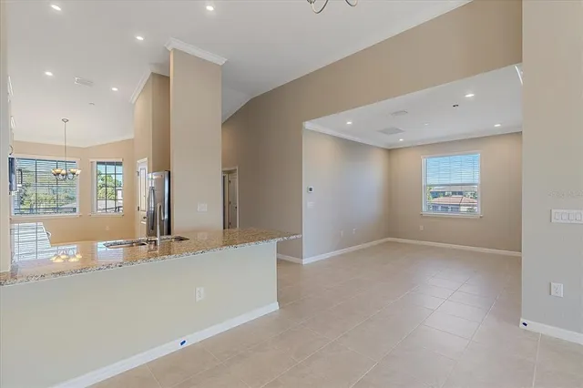 an empty room with large windows