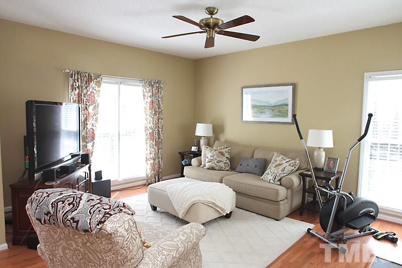 5501 Edgebury Road Raleigh, NC 27613 - Photo 2 of 14 a living room with furniture and a flat screen tv