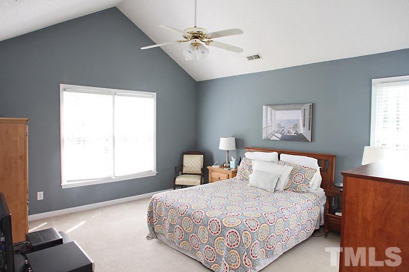 5501 Edgebury Road Raleigh, NC 27613 - Photo 10 of 14 a bedroom with a bed and a window