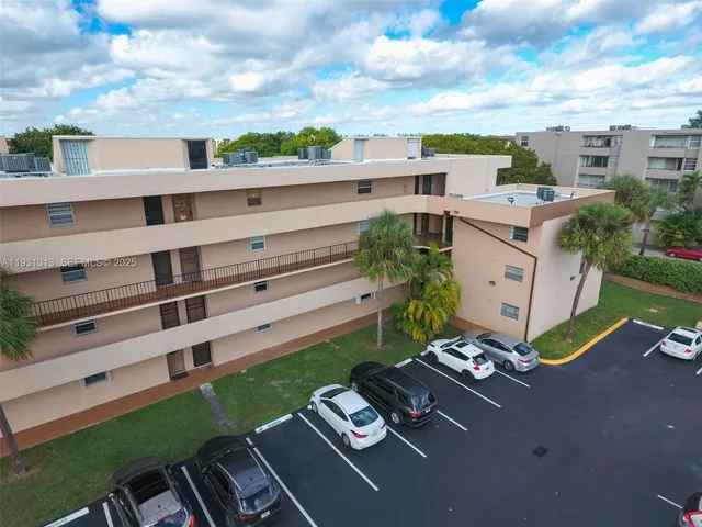 a view of a patio with table and chairs and potted plants