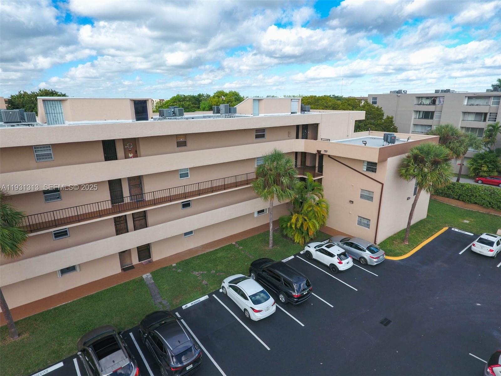 a view of a patio with table and chairs and potted plants