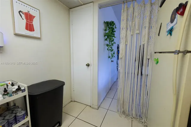 a view of room with refrigerator and toys