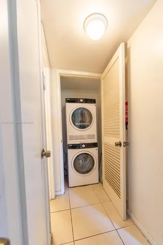 a bedroom with furniture and a flat screen tv