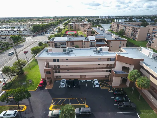 an aerial view of a house with yard swimming pool and outdoor seating