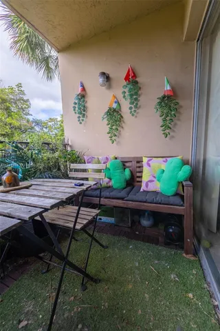 a view of a backyard with sitting area
