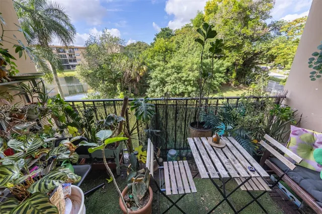 a view of an apartment with a swimming pool